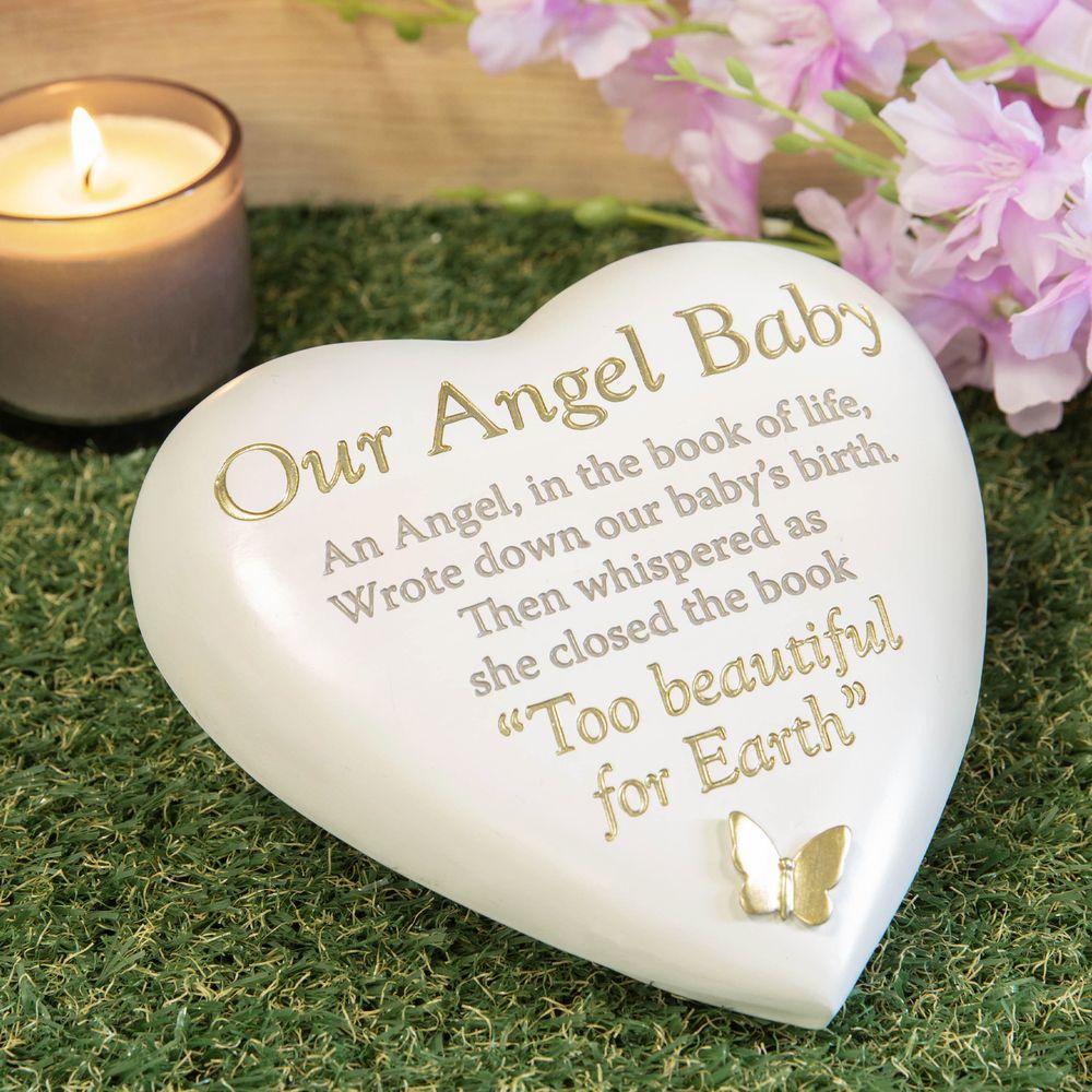 Outdoor Memorial Tribute. White Heart Shaped. Gold Butterfly. 'Our Angel Baby'.